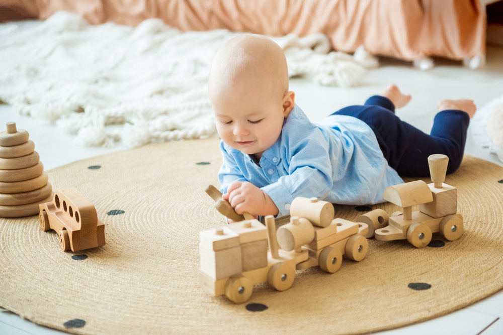 Safe wooden toys for tummy time fun